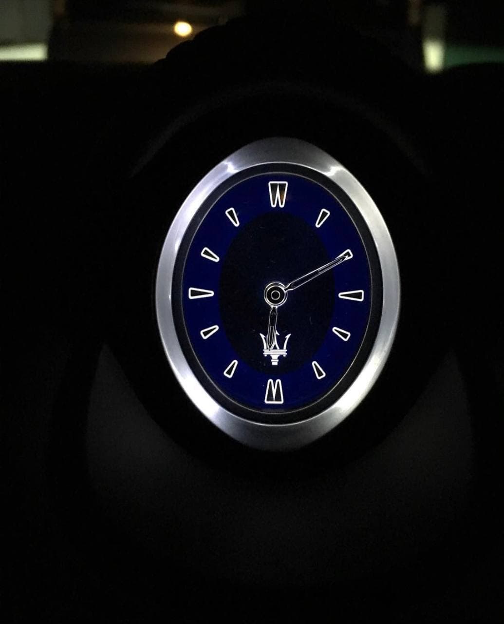 Close view of a blue oval luxury watch dial